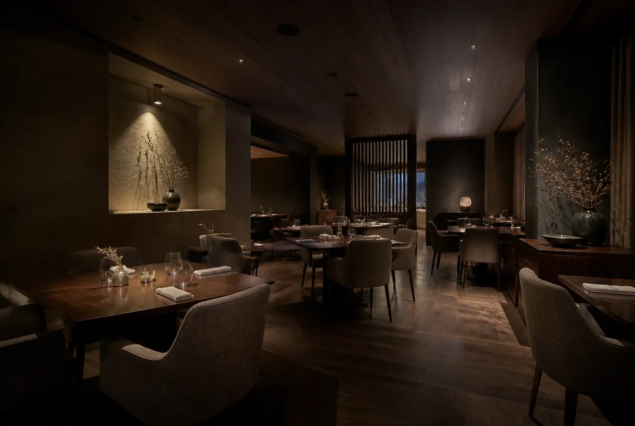 Fine dining tasting room with widely spaced tables, low light levels and generous service aisles